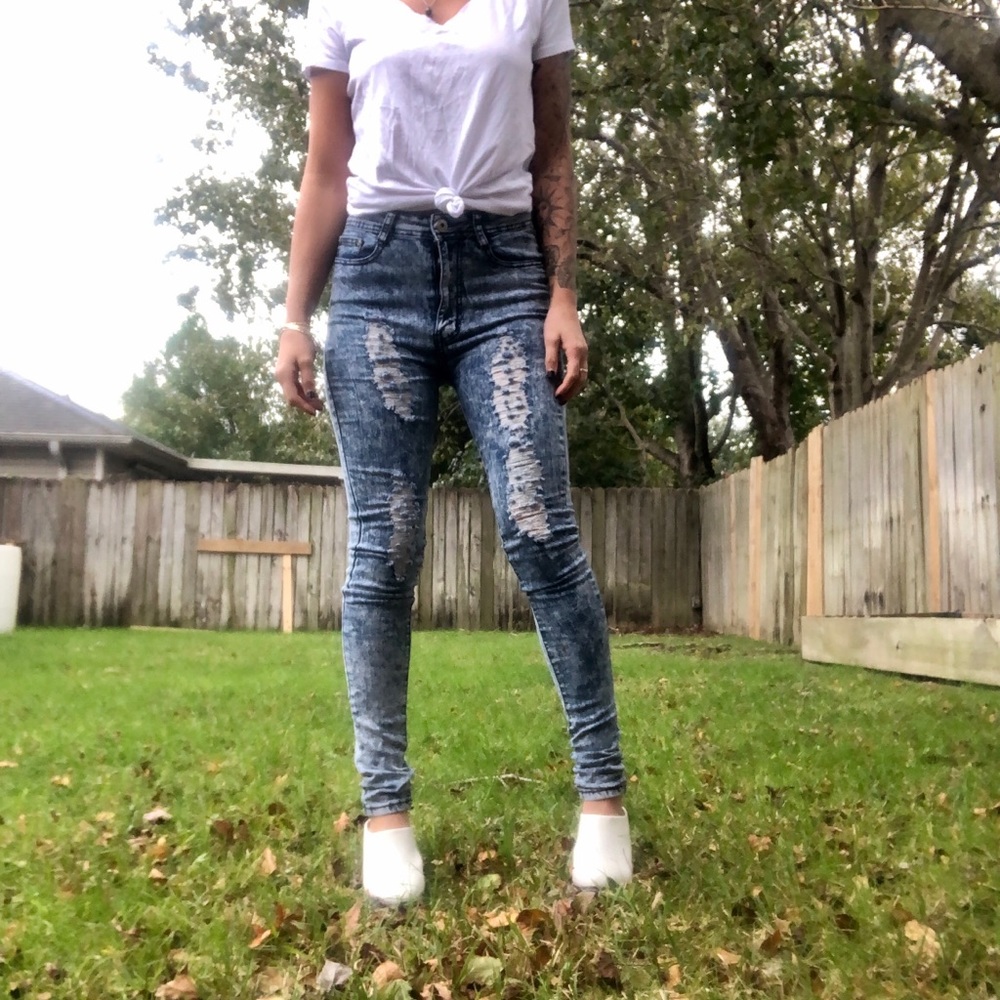 Acid wash ripped jeans